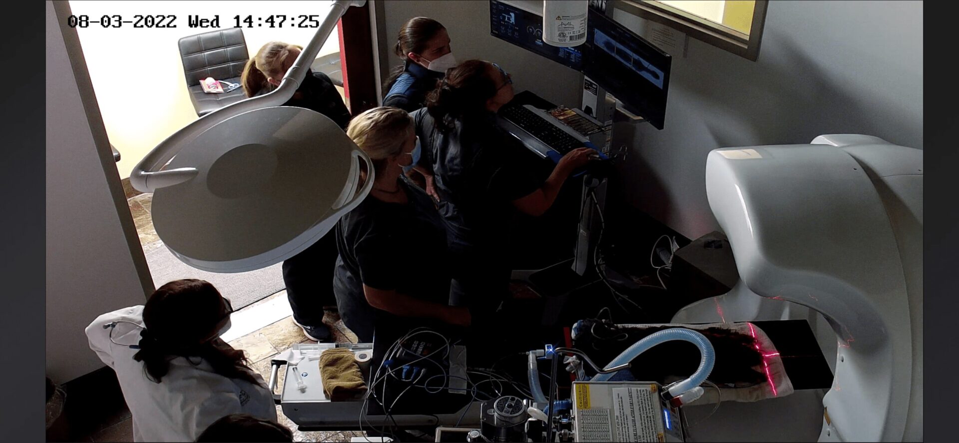 A picture of concerned nurses looking at the screen
